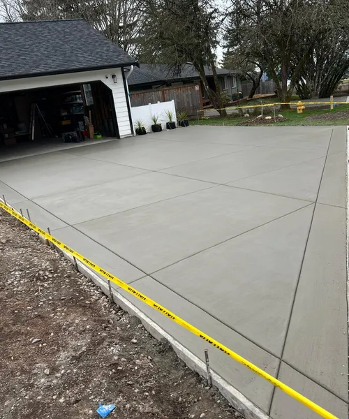 Broom Finish Driveway Replacement With Decorative Borders in Newcastle 